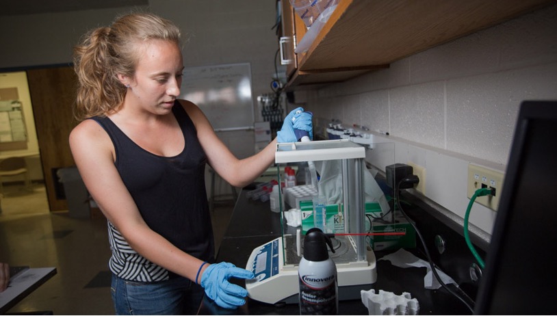 Physics student working in a laboratory