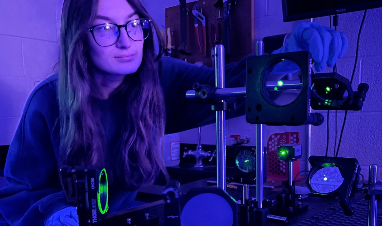 Physics student working in a laboratory