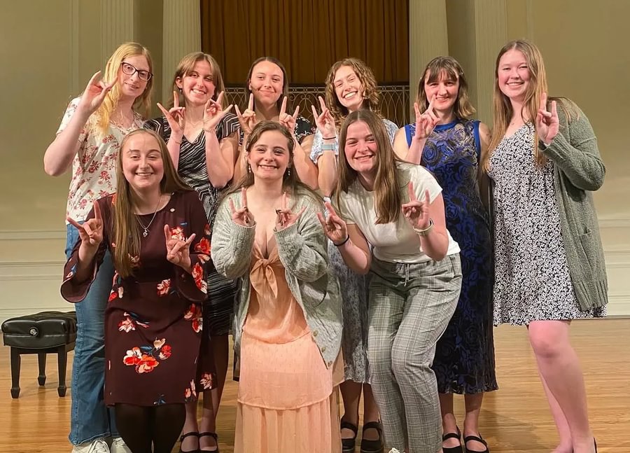 Green with fellow members of the Epsilon Beta chapter of Sigma Alpha Iota following the Songs of Support Benefit Recital in spring 2025.
