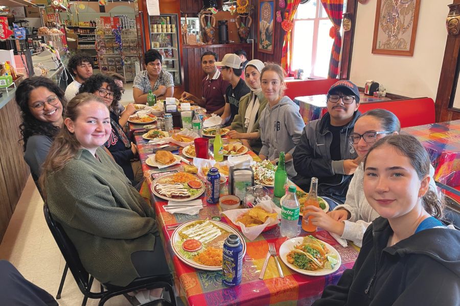 First-Year Seminar students share a meal on a 2024 field trip.