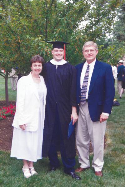 Nathan and his parents at Commencement.